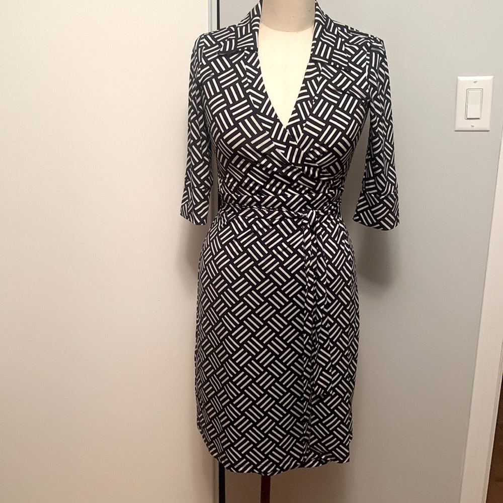 Femme brand wrap dress navy and white geo print with 3/4 sleeve. Size S